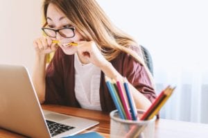 Woman frustrated at computer.