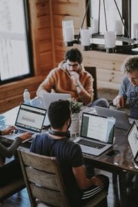 Group of people working on laptops. 